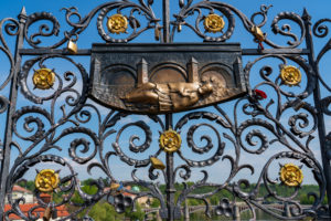 A wrought iron grid of St. John of Nepomuk on Charles Bridge